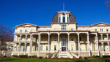 A large, historic building with a central dome and symmetrical architecture.