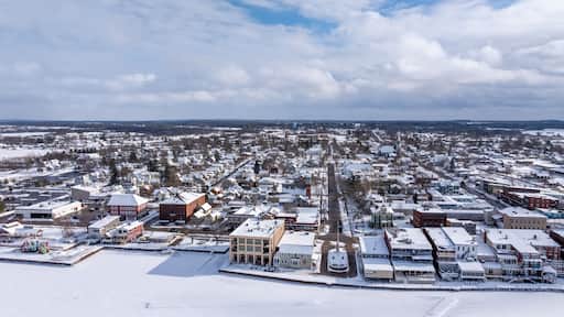 Clayton, NY, USA - 02-09-2025: Winter aerial image Clayton, NY along a frozen St Lawrence River