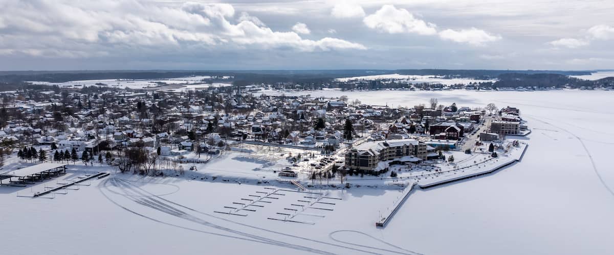 Clayton, NY, USA - 02-09-2025: Winter aerial image Clayton, NY along a frozen St Lawrence River