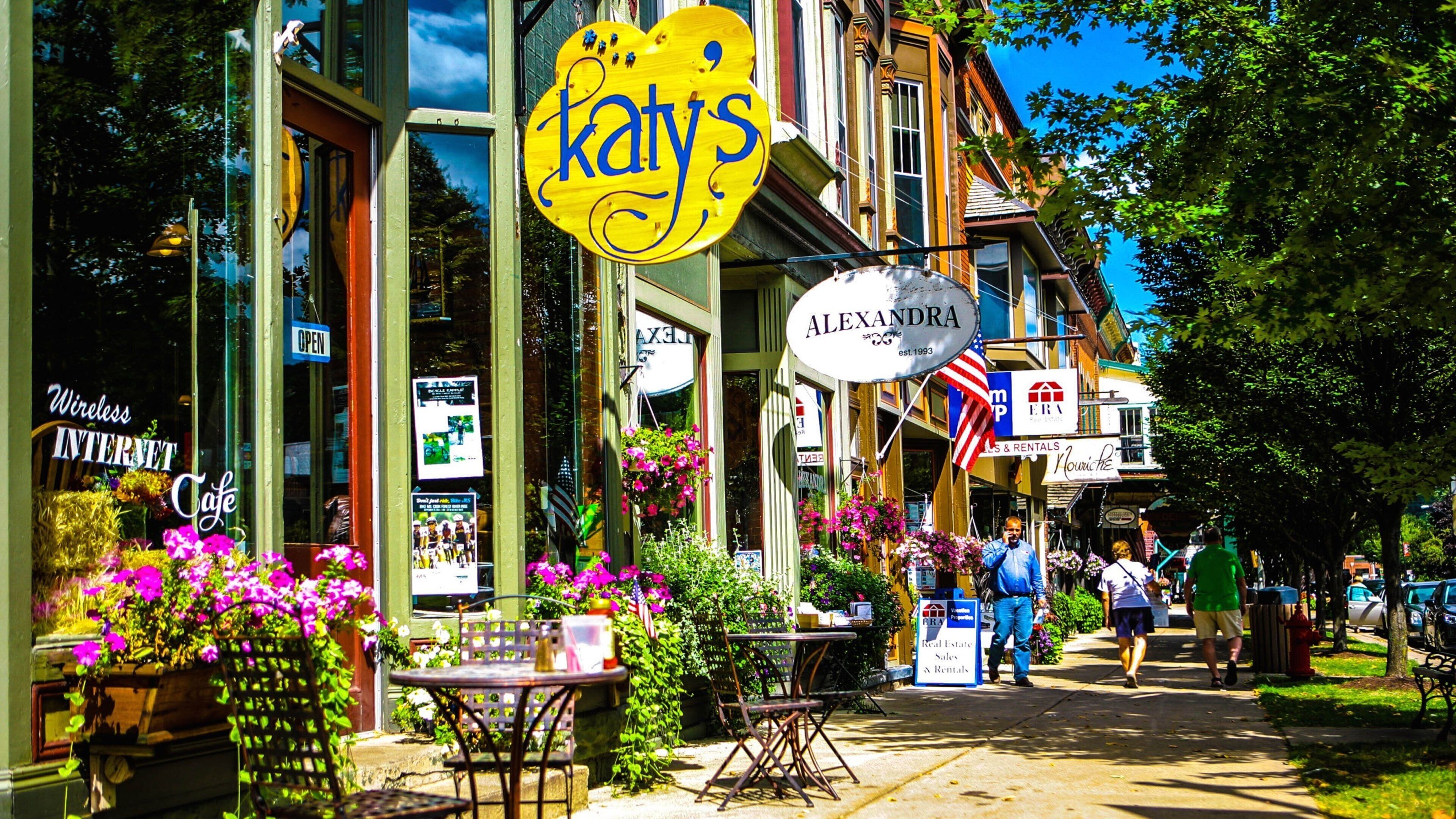 A street with a yellow sign reading "Katy's" and a white sign for "Alexandra".
