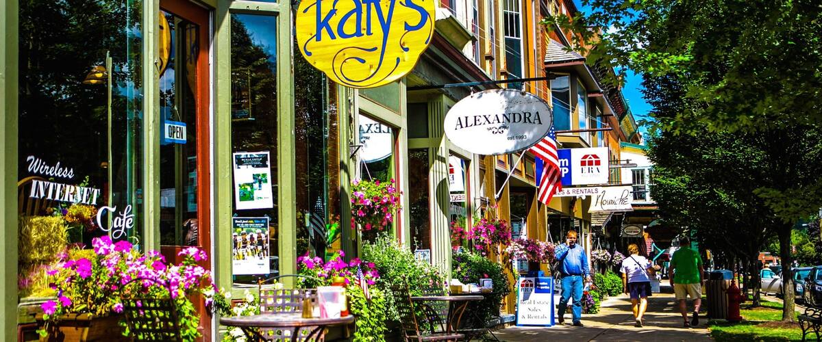 A street with a yellow sign reading "Katy's" and a white sign for "Alexandra".