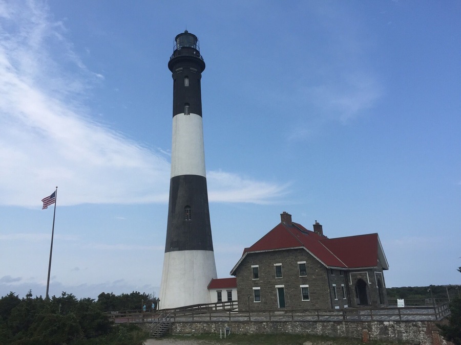 The Fire Island Lighthouse is a visible landmark on the Great South Bay, in southern Suffolk County, New York on the western end of Fire Island, a barrier island off the southern coast of Long Island