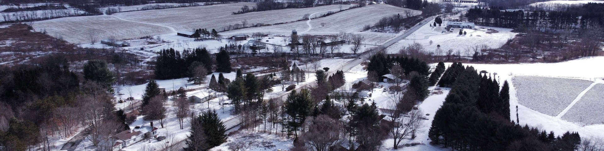 Bird's eye view of the cityscape of Hillsdale, New York under a cloudy sky in winter