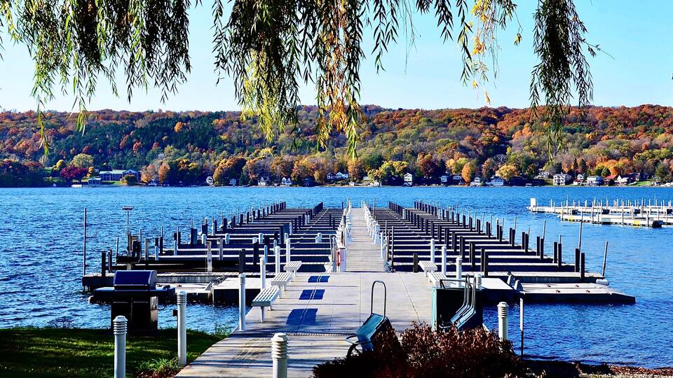 Marina pier with docks on Keuka Lake in Penn Yan, Finger Lakes region, New York. Amazing natural beauty. Late autumn season