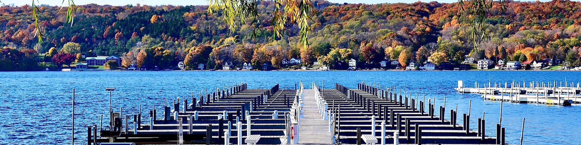 Marina pier with docks on Keuka Lake in Penn Yan, Finger Lakes region, New York. Amazing natural beauty. Late autumn season