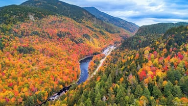 An amazing drive is route 86. Its full of fall colors and scenic spots to view the colors. It is also a great route to hike the small mountains of the Adirondacks. Worth a visit and enjoying a sunny day.