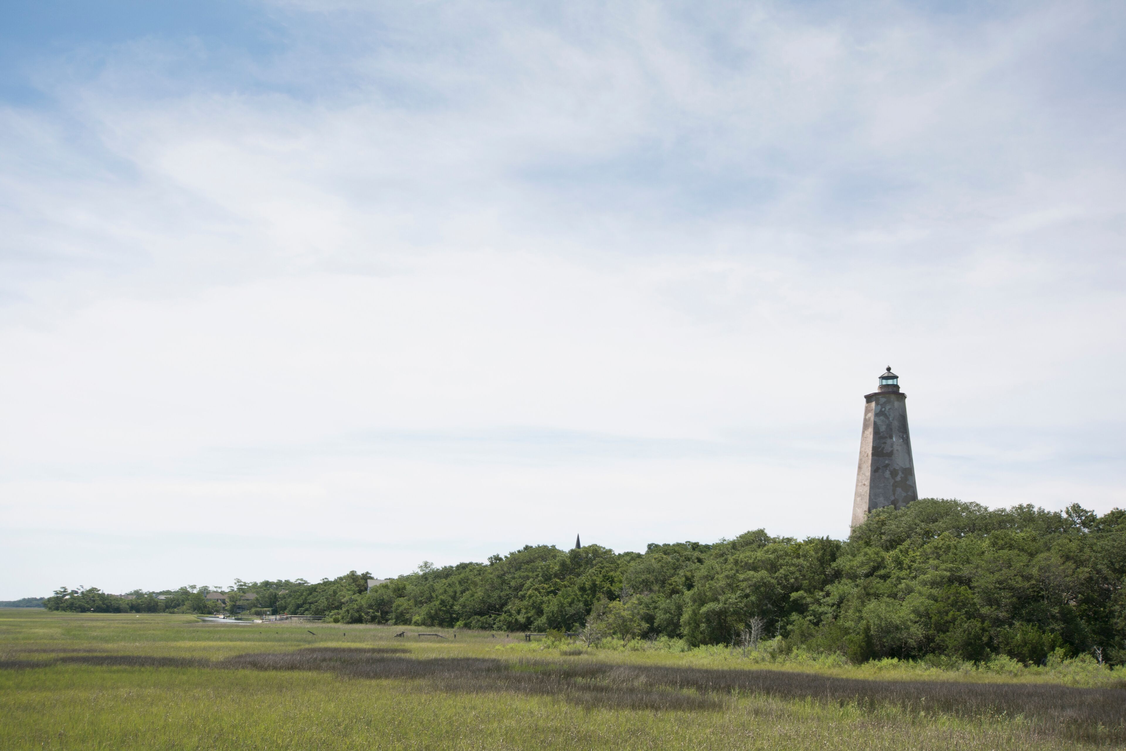 A tower, a forest, and a field.