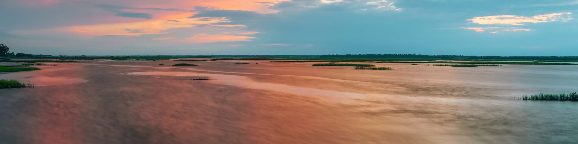 A river with a sunset sky.