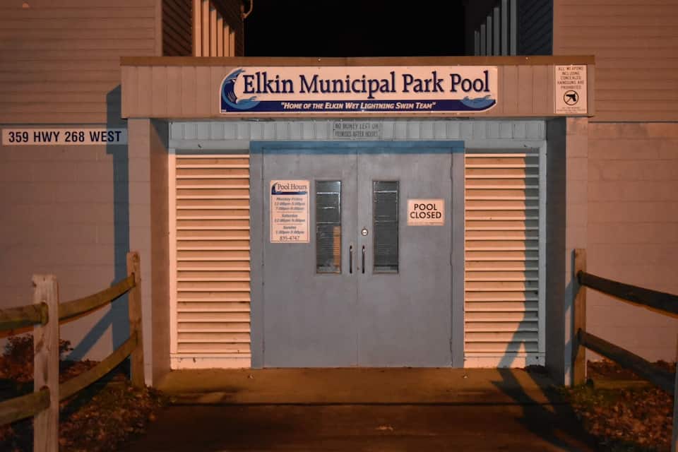The Elkin Municipal Park Pool entrance with a closed pool sign.