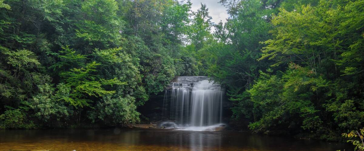 The short but beautiful Schoolhouse Falls in the Panthertown Valley area of the Nantahala National Forest.  It is a very pristine area of the forest.
For a video guide of the hike to this spot, please visit:  https://www.hdcarolina.com/episode/schoolhouse-falls