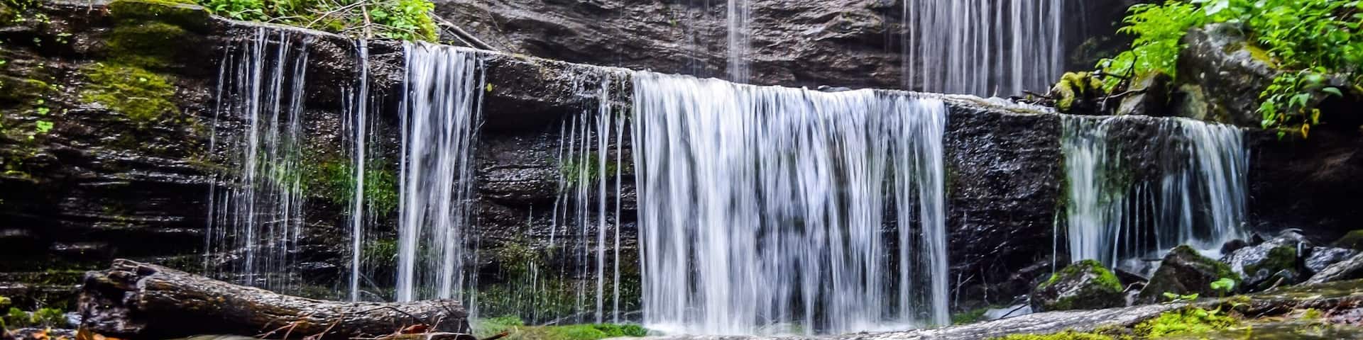 Grassy Creek Falls! The parking area is very near the exit on the Blue Ridge Parkway for Little Switzerland milepost 334. The waterfalls is on private property but open to the public.