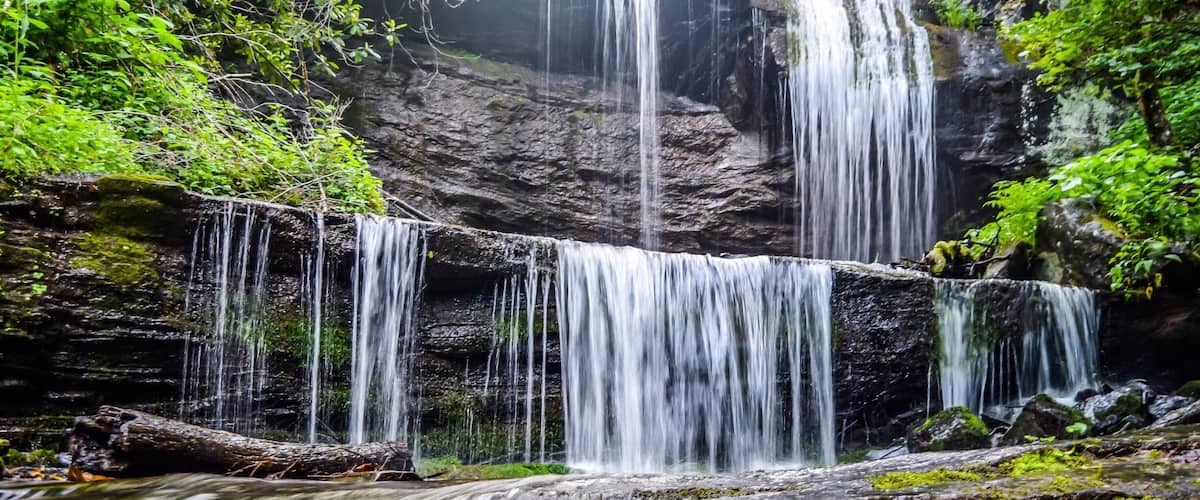 Grassy Creek Falls! The parking area is very near the exit on the Blue Ridge Parkway for Little Switzerland milepost 334. The waterfalls is on private property but open to the public.
