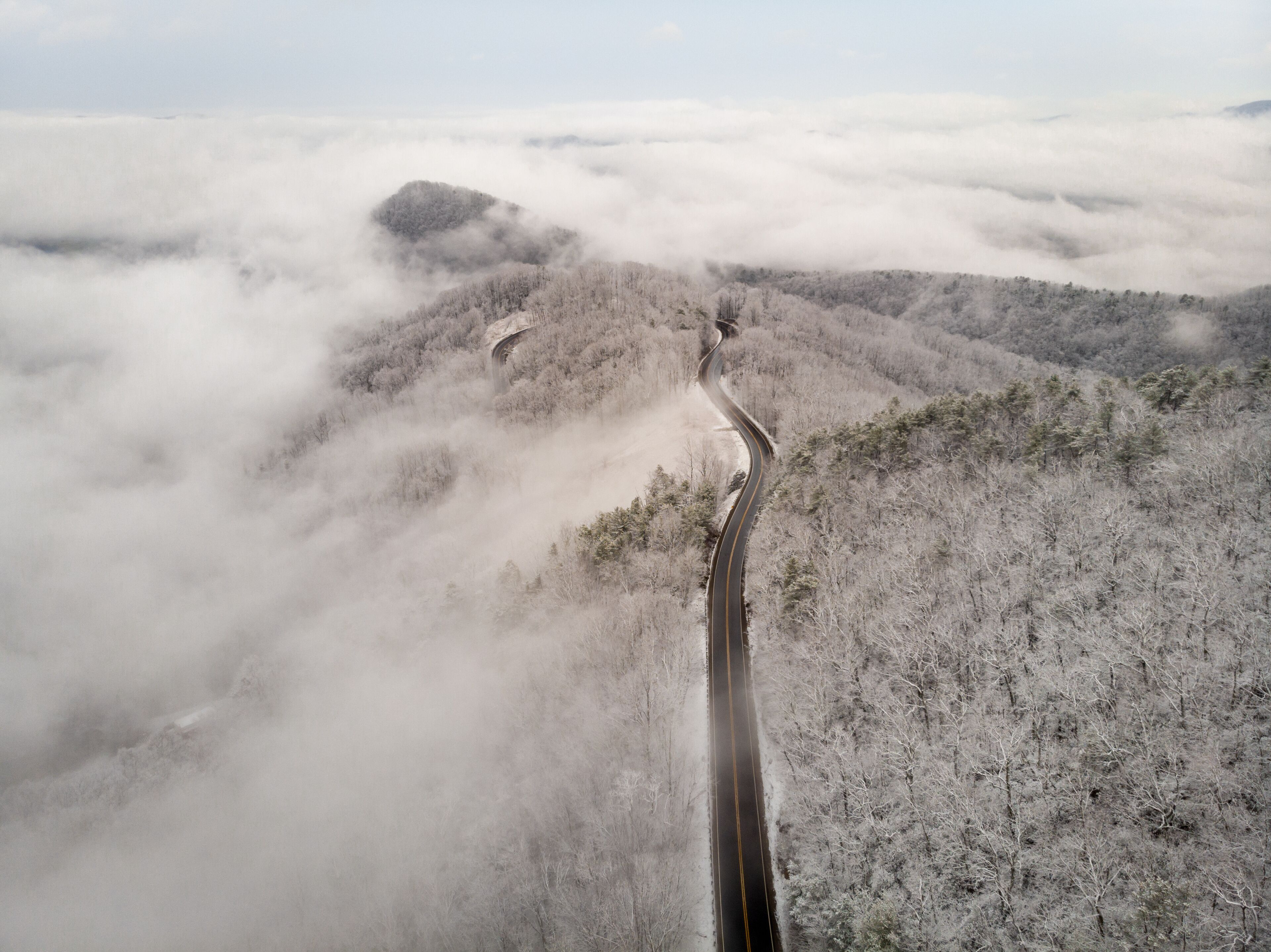 Aerial View of Winding North Carolina Mountain Road in the Snow