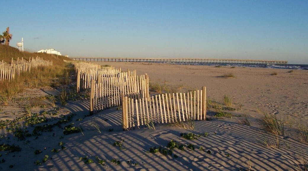 Looking toward the fishing pier at Sunset Beach, a family beach with next to no commercial interests. No hotels, just homes.