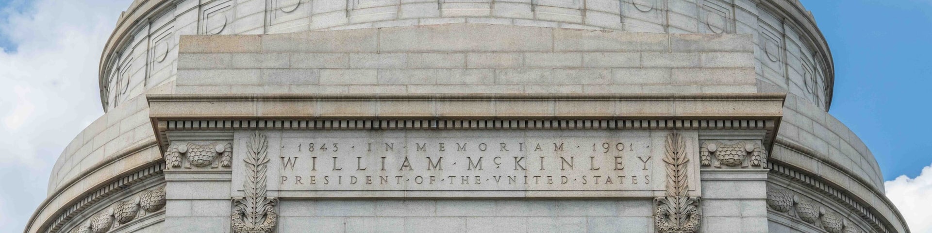 A large stone dome with inscriptions commemorating President William McKinley.