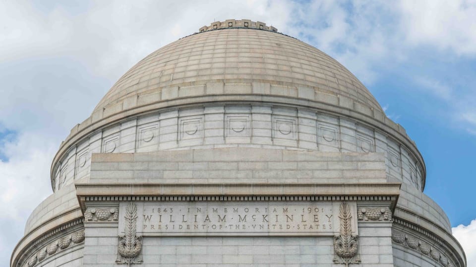 A large stone dome with inscriptions commemorating President William McKinley.