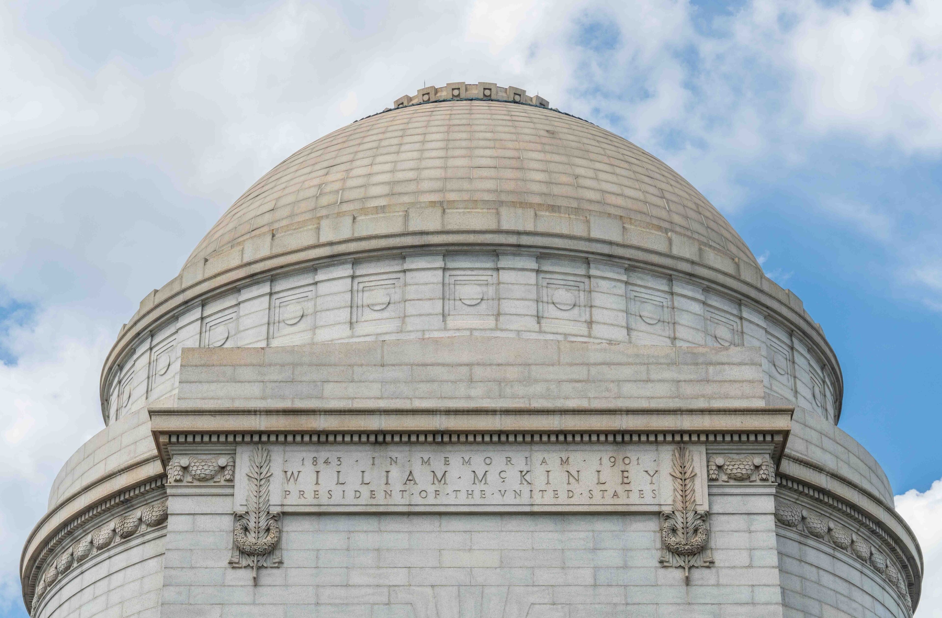 A large stone dome with inscriptions commemorating President William McKinley.