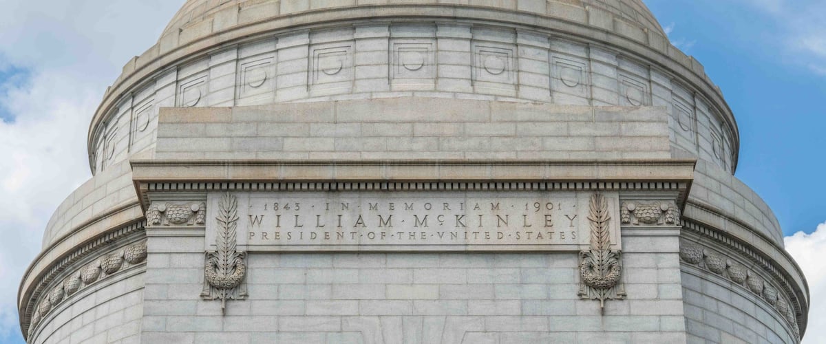 A large stone dome with inscriptions commemorating President William McKinley.