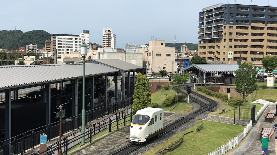 In the railway museum of Kokura children have fun in these tiny trains as conductors and operators.