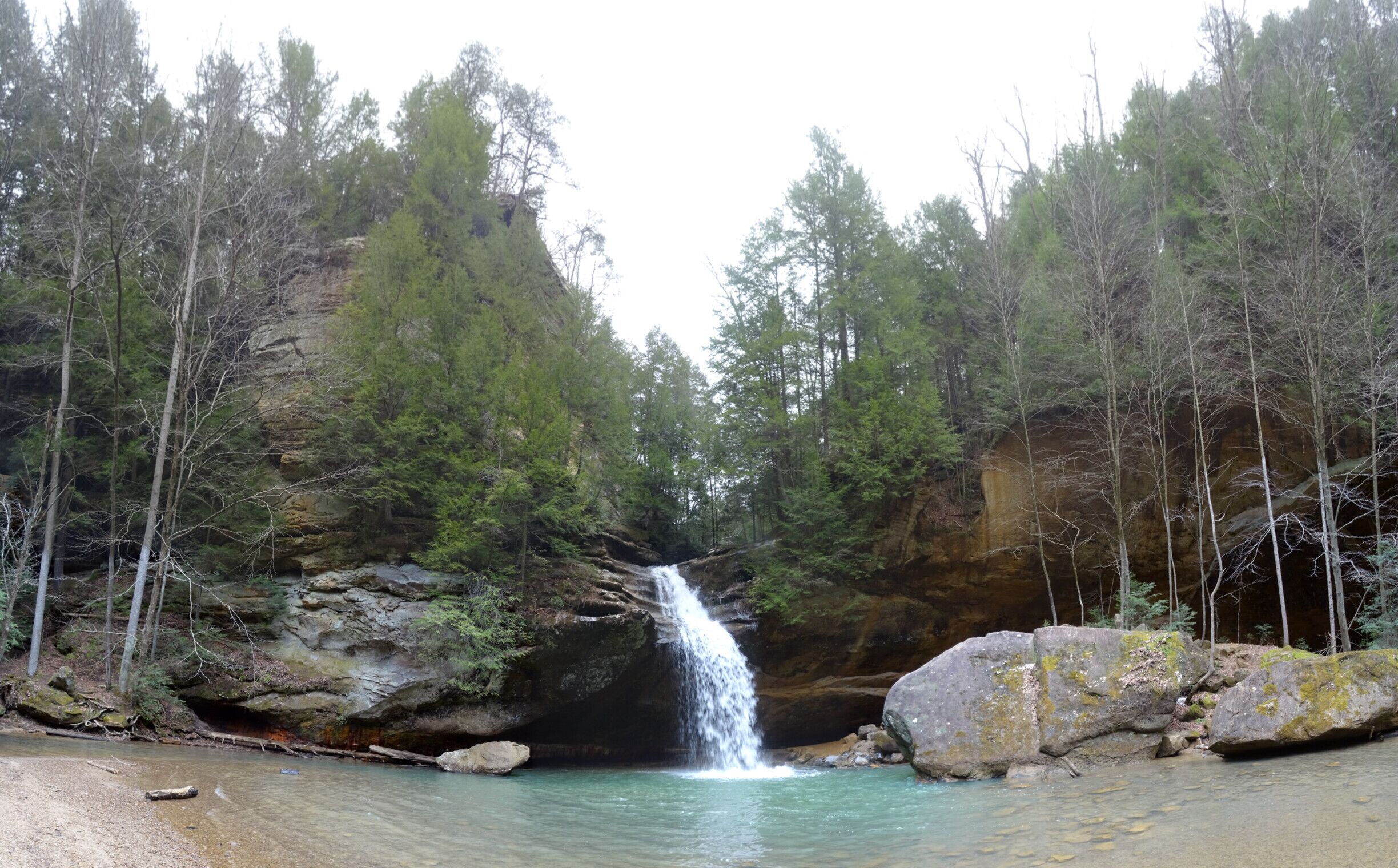 The lower falls at Old Man's Cave.

If you want to see the falls at their peak, head there in late winter/early spring just as the snow melts and preferably after a heavy rain fall. Also if your schedule permits, head there on a weekday morning and you just might have the place to yourself for a bit. 

Old Man's Cave derives its name from the hermit Richard Rowe who lived in the large recess cave of the gorge. Rowe lived out his life in the area and is buried beneath the ledge of the main recess cave.