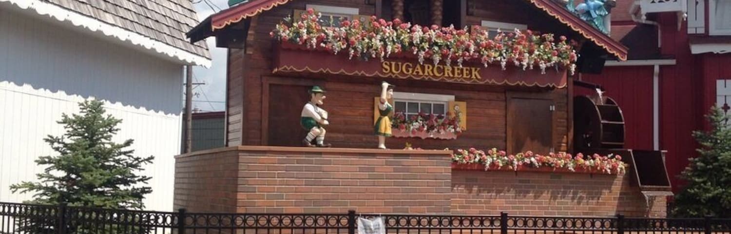 World's largest Cuckoo Clock in Sugar Creek, Ohio. When it chimes, little puppets come out one door and play a song, then go back in the other door.