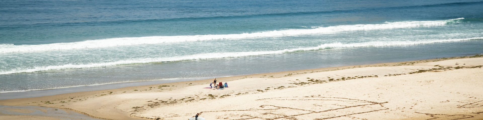 Oceanside which includes a sandy beach, island views and general coastal views