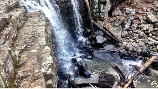 Ringing rocks county park is mostly known for its field of boulders, that, when struck with a hammer, ring out in a variety of tones not normally associated with rocks. For first time visitors, it's amazing, and for musically inclined people, it may hold the entirety of their interest.
However, if one is to hike beyond the boulder field (fun in and of itself, rock hopping) there is a creekbed that is hewn into the side of the hill, cascading across a variety of stone waterfalls. Hiking north along these beautiful steps brings you to this, the largest waterfall in Bucks County.
The park is, without a doubt, one of my favorite places in the county, and perhaps the state. A great place to spend an afternoon.