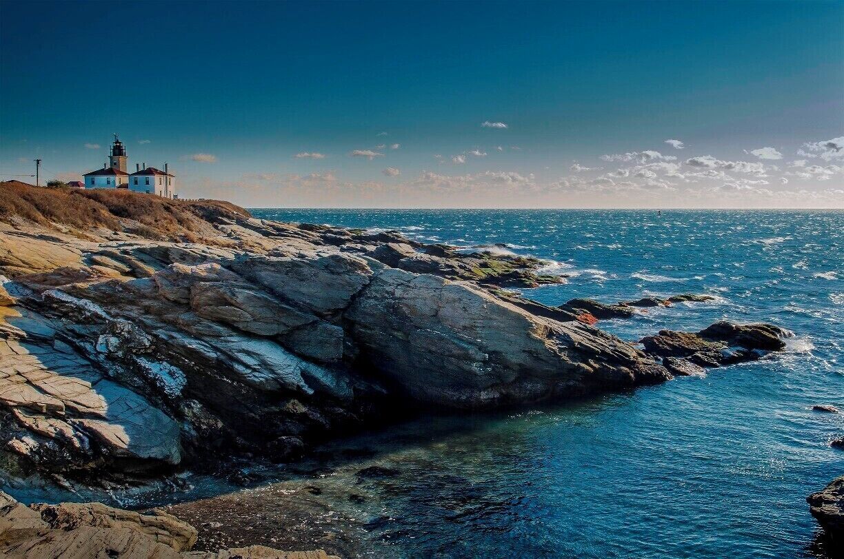 Beavertail Lighthouse, built in 1749, was and still is the premier lighthouse in Rhode Island, especially for entrance into Narragansett Bay.

From here, one could watch out and see the America's Cup races. 

This shot was taken late in the day, the warm glow of a setting sun lighting up the coastline.