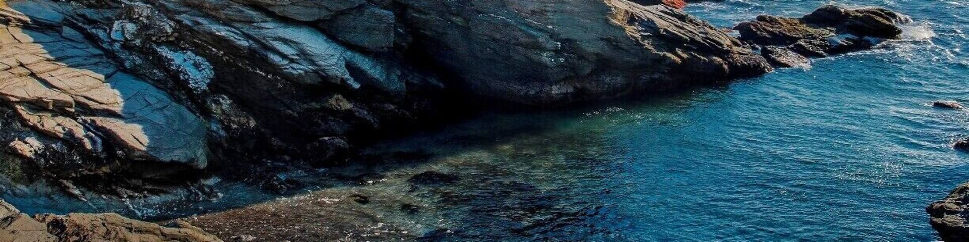 Beavertail Lighthouse, built in 1749, was and still is the premier lighthouse in Rhode Island, especially for entrance into Narragansett Bay.
From here, one could watch out and see the America's Cup races.
This shot was taken late in the day, the warm glow of a setting sun lighting up the coastline.