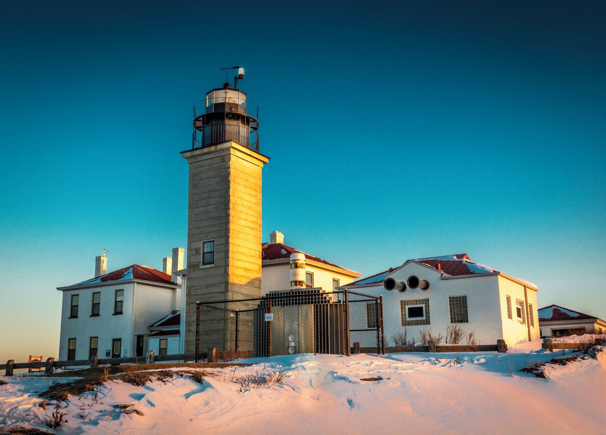 Caught the early morning sun as it rose over the horizon, its rays warming up this lighthouse on a very cold winter's day.