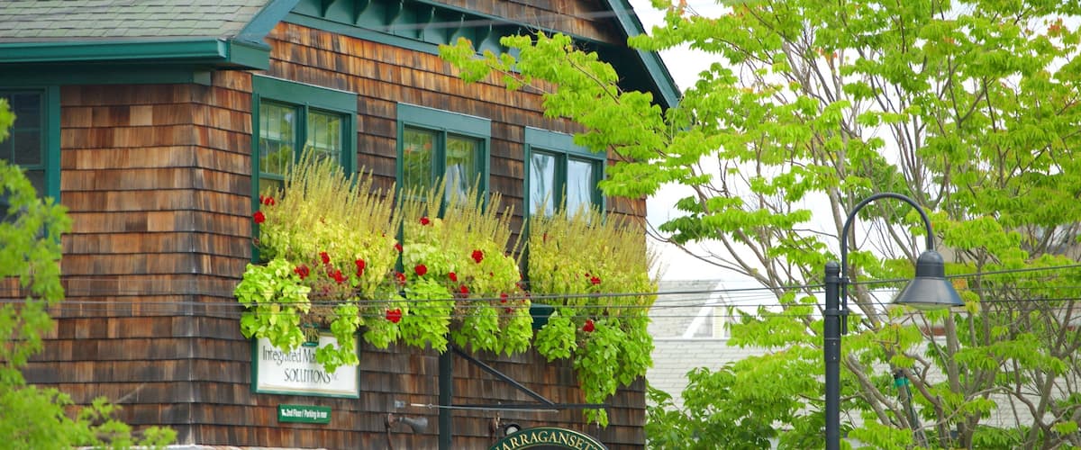 A wooden building with a sign reading "Narragansett 28 Avenue".