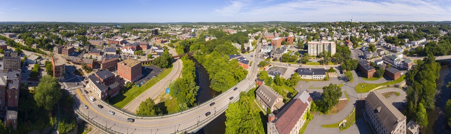 Blackstone River and Woonsocket Main Street Historic District panorama aerial view in downtown Woonsocket, Rhode Island RI, USA.