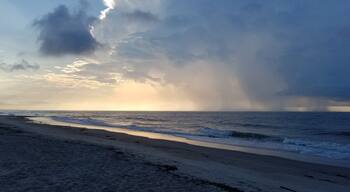 Rain over the ocean at sunrise. Edisto beach is quiet and beautiful. The perfect place to just enjoy the surf.