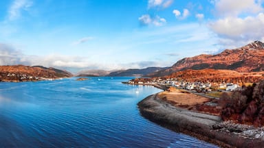 Aerial panoramic view of blue water with mountains on the shore in Kyle of Lochalsh, Scotland, UK