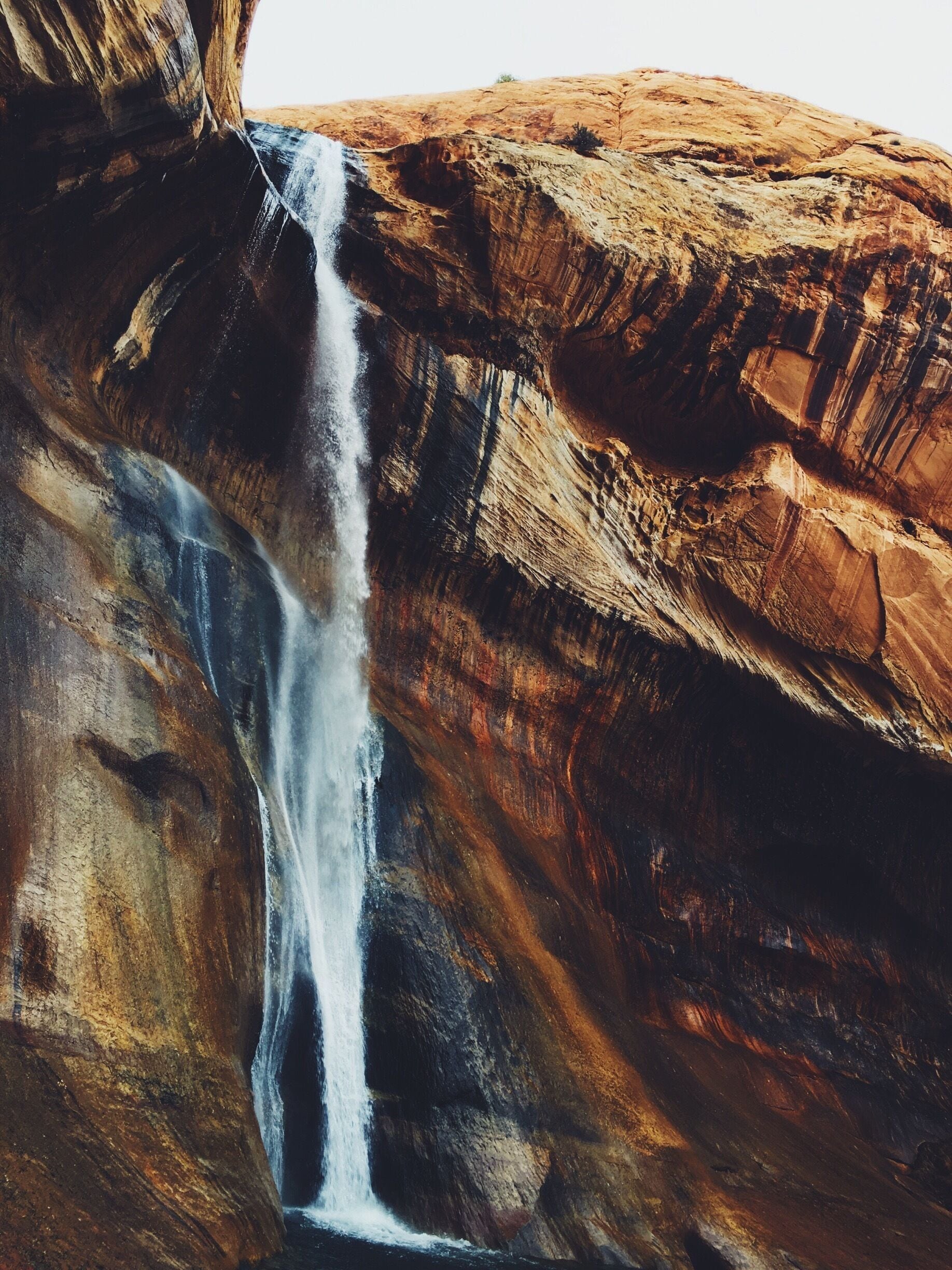 A waterfall cascading down a rocky cliff.
