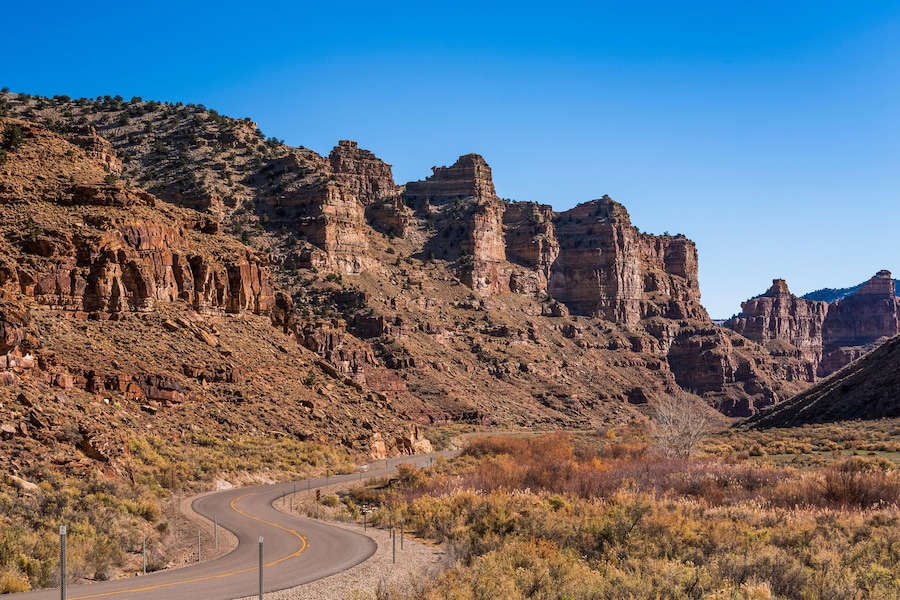 Road winding through the scenic sandstone cliffs of Nine Mile Canyon, called the Longest Art Gallery in the World, Utah, USA