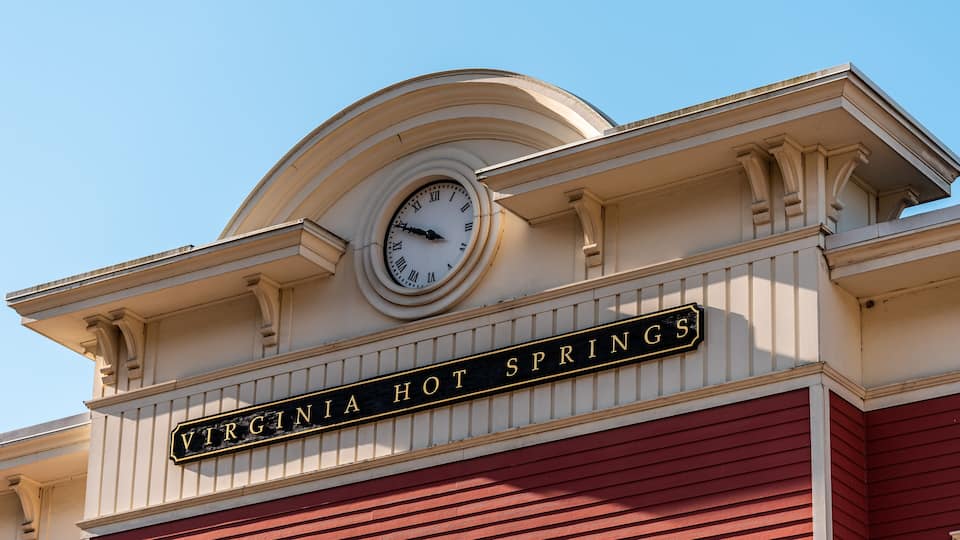 A clock and a sign that reads "Virginia Hot Springs".