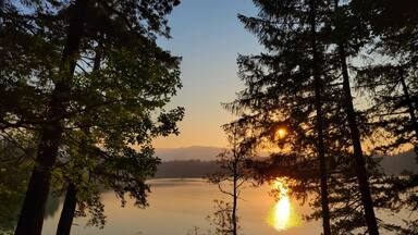 Sunset with wildfire smoke at Clear Lake in Yelm Washington state