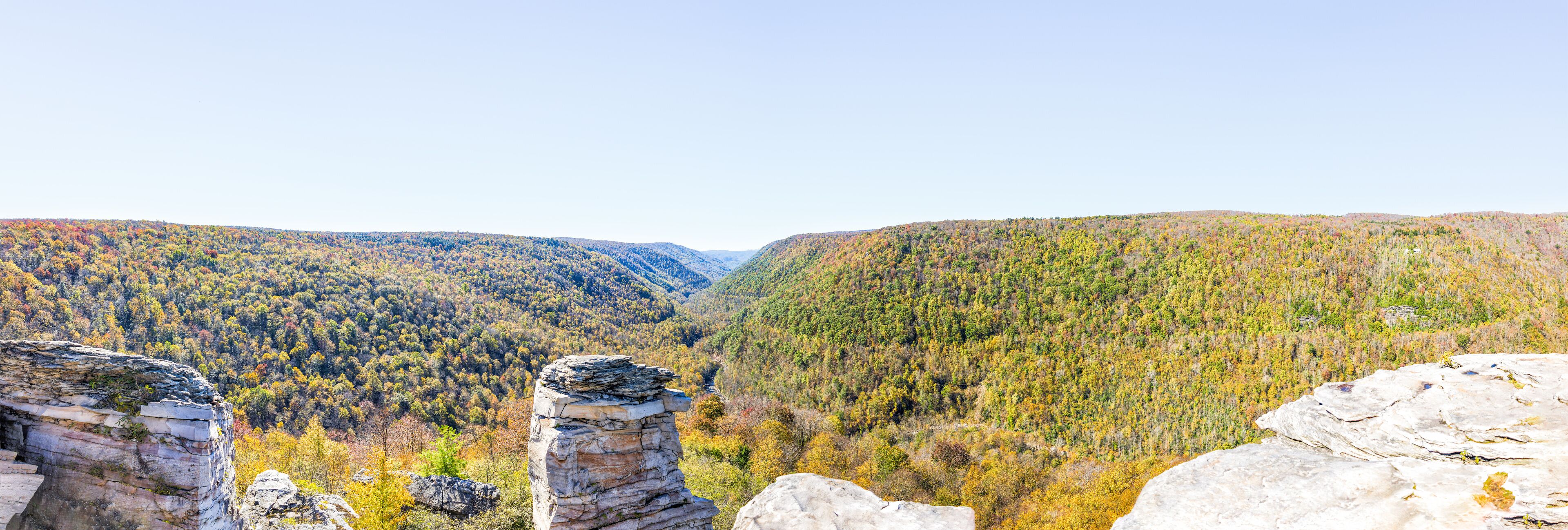 Panorama of canaan valley mountains in Blackwater falls state park in West Virginia during colorful autumn fall season with yellow foliage on trees, rock cliff at Lindy Point