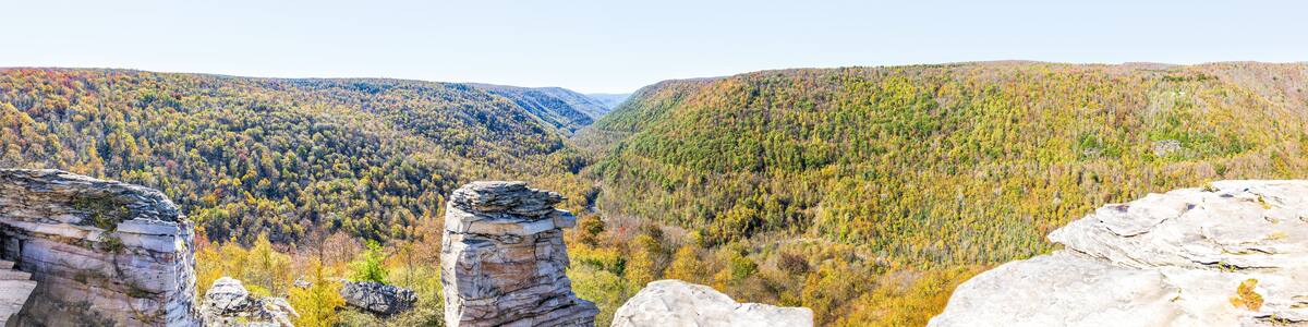 Panorama of canaan valley mountains in Blackwater falls state park in West Virginia during colorful autumn fall season with yellow foliage on trees, rock cliff at Lindy Point