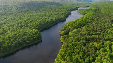 Aerials Over Big Lake in Forest Covered Hills
