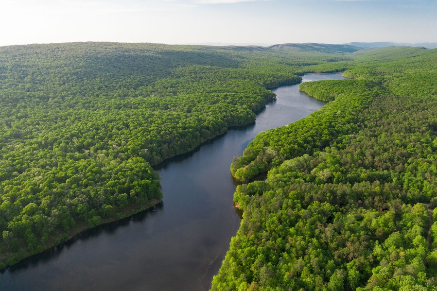 Aerials Over Big Lake in Forest Covered Hills