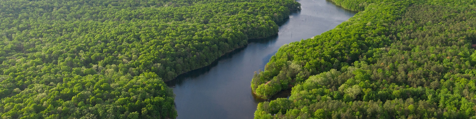 Aerials Over Big Lake in Forest Covered Hills
