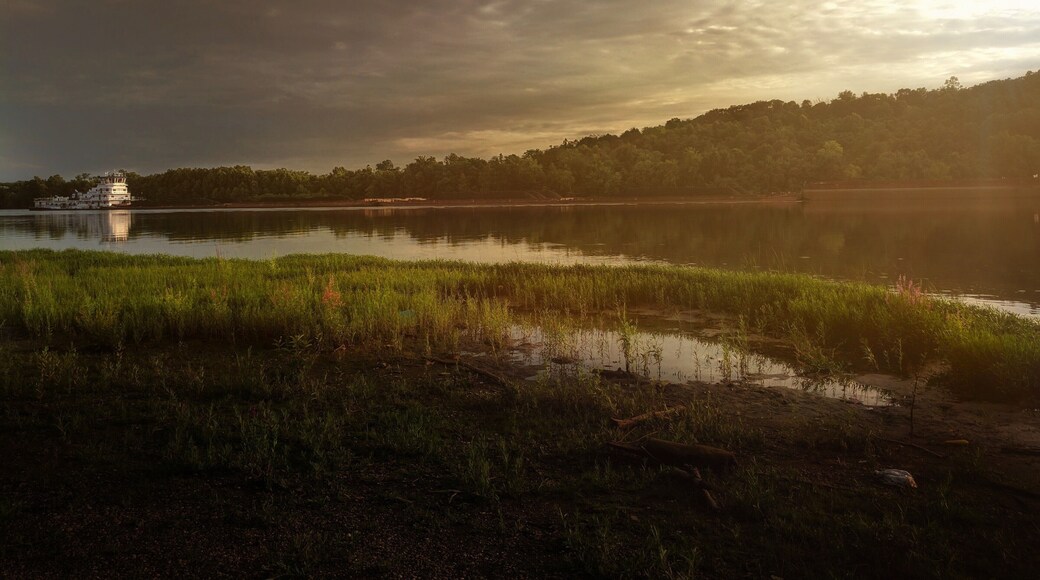 Barge heading into the sunset on the Ohio River.