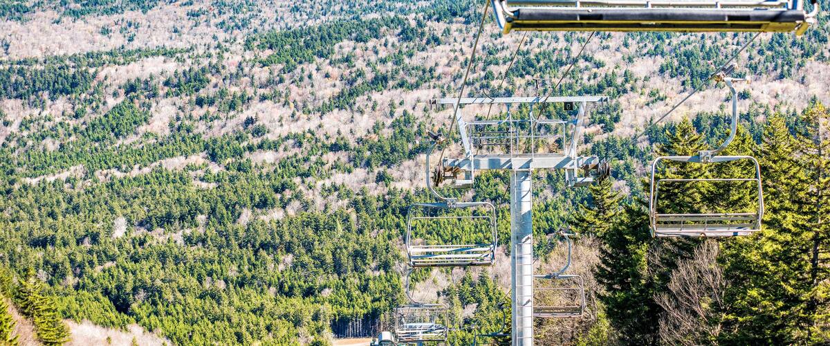 Ski lift with view of mountains empty, nobody in autumn fall season in Snowshoe, West Virginia, WV