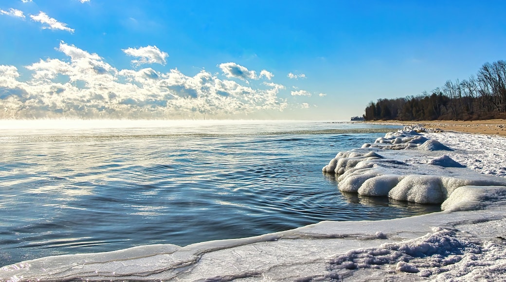 A frozen lake with ice formations and a clear sky.