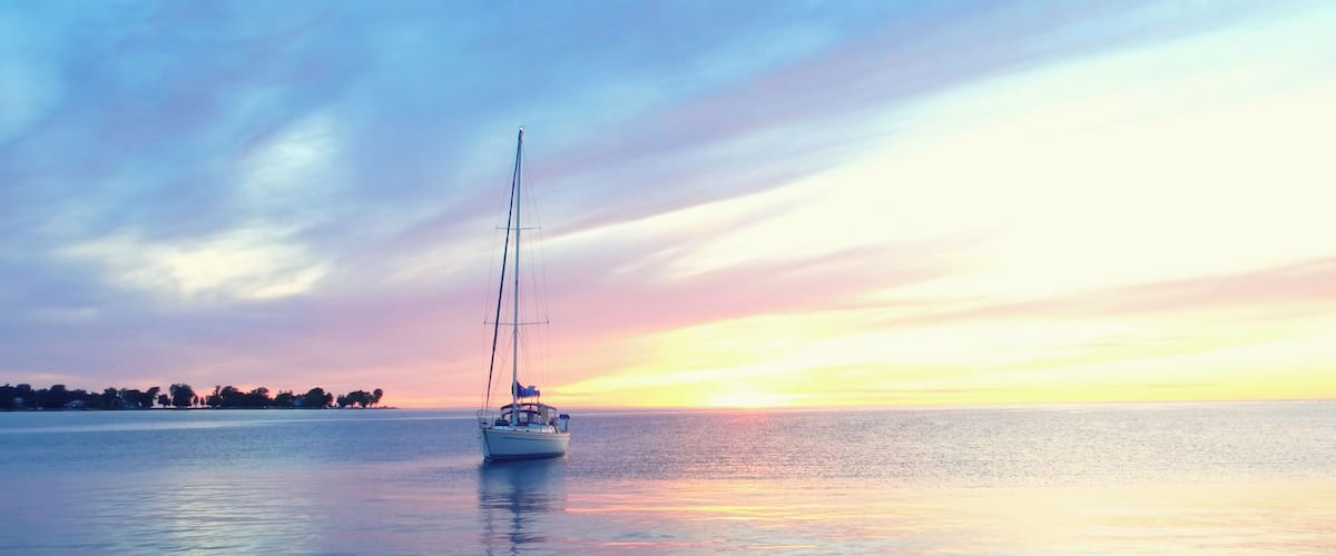 Sailboat drifts through bay in Egg Harbor.
