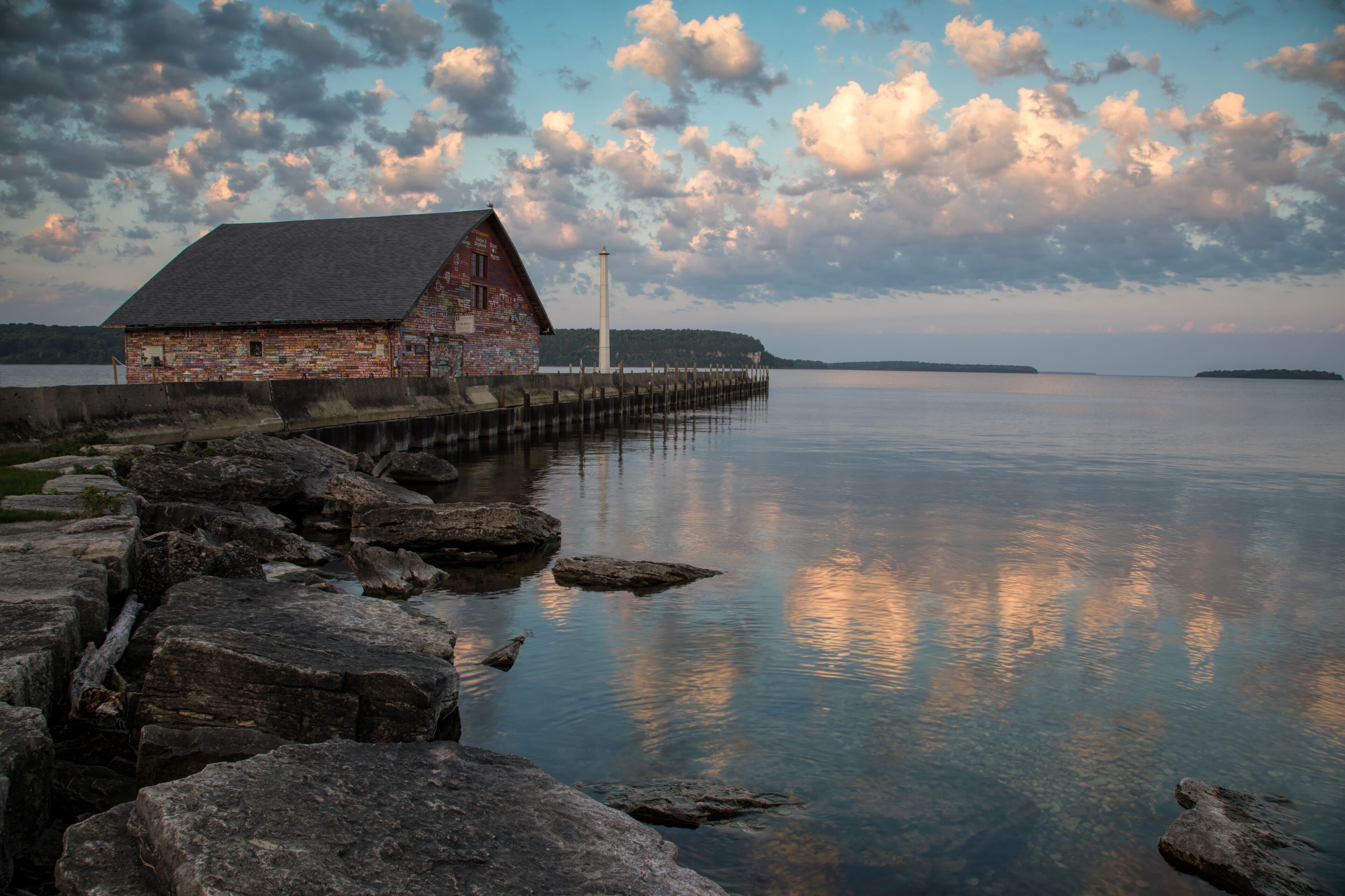 Striking sunrise sky over Anderson Boathouse. Door County Ephraim Wisconsin.