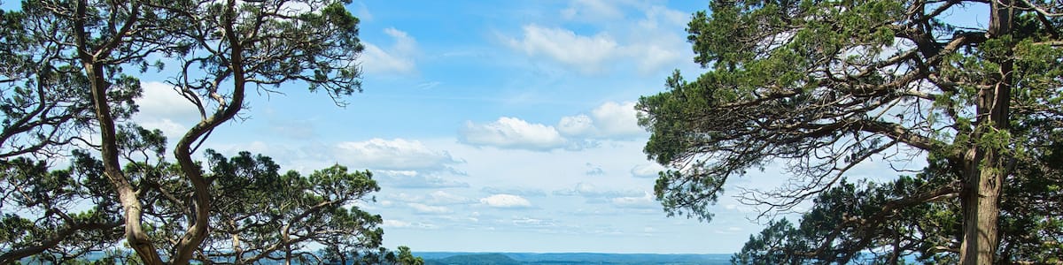 Sunny Summer day landscape of lush green fields and forests as seen from the top of Gibraltar Rock near Lodi, Wisconsin.