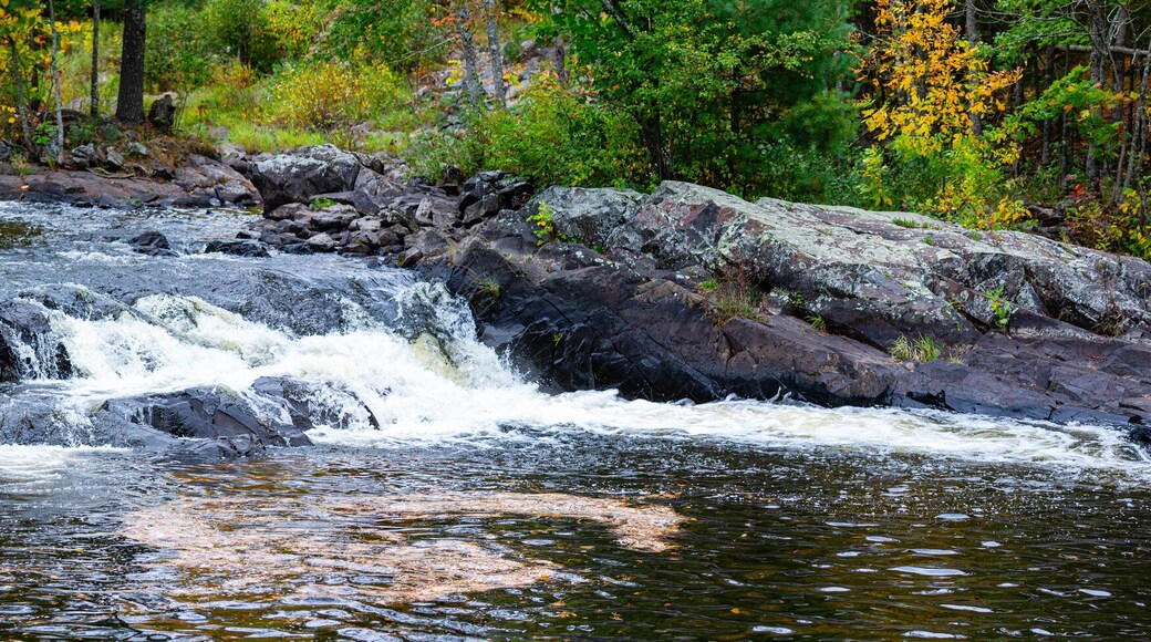Waterfalls flowing into Lake of the Falls in Mercer, Wisconsin in September